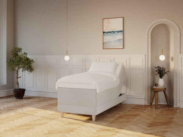 Aura Älv 90x200 Bouclé cream Nordic Dream tilbyr senger med skandinavisk design og materialer av høy kvalitet. Opplev perfekt komfort for en god natts søvn. Bestill din i dag!