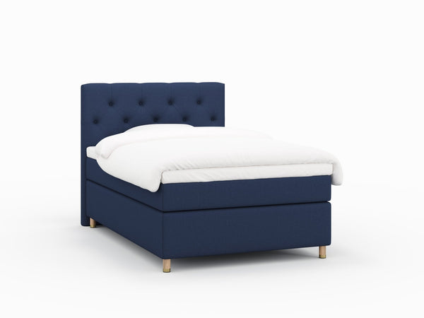 Nora Fjäll 140x200 Mørkeblå Nordic Dream tilbyr senger med skandinavisk design og materialer av høy kvalitet. Opplev perfekt komfort for en god natts søvn. Bestill din i dag!