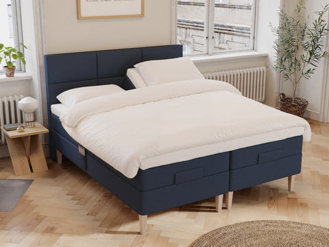 Ragna Älv 180x210 Mørkeblå Nordic Dream tilbyr senger med skandinavisk design og materialer av høy kvalitet. Opplev perfekt komfort for en god natts søvn. Bestill din i dag!