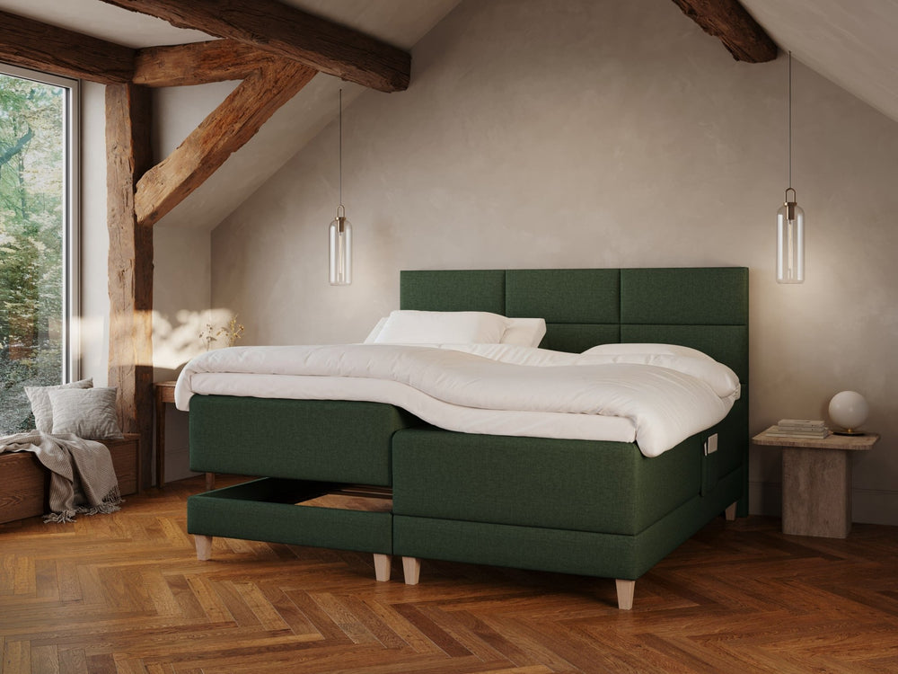 Aura Fjäll 210x210 Mørkegrøn Nordic Dream tilbyr senger med skandinavisk design og materialer av høy kvalitet. Opplev perfekt komfort for en god natts søvn. Bestill din i dag!