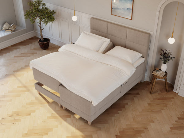 Aura Fjord 160x200 Bouclé latte Nordic Dream tilbyr senger med skandinavisk design og materialer av høy kvalitet. Opplev perfekt komfort for en god natts søvn. Bestill din i dag!