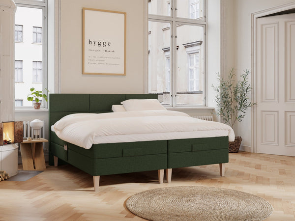 Ragna Fjord 210x210 Mørkegrøn Nordic Dream tilbyr senger med skandinavisk design og materialer av høy kvalitet. Opplev perfekt komfort for en god natts søvn. Bestill din i dag!