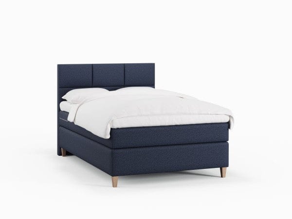 Snefrid Nordlys 120x200 Mørkeblå Nordic Dream tilbyr senger med skandinavisk design og materialer av høy kvalitet. Opplev perfekt komfort for en god natts søvn. Bestill din i dag!