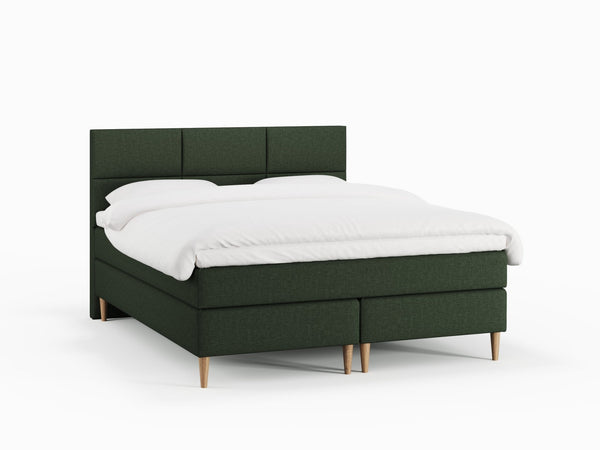 Svanhild Fjord 180x210 Mørkegrøn Nordic Dream tilbyr senger med skandinavisk design og materialer av høy kvalitet. Opplev perfekt komfort for en god natts søvn. Bestill din i dag!
